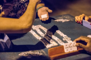 Detail views of dominoes players, parlour game Detail views of dominoes players, parlour game